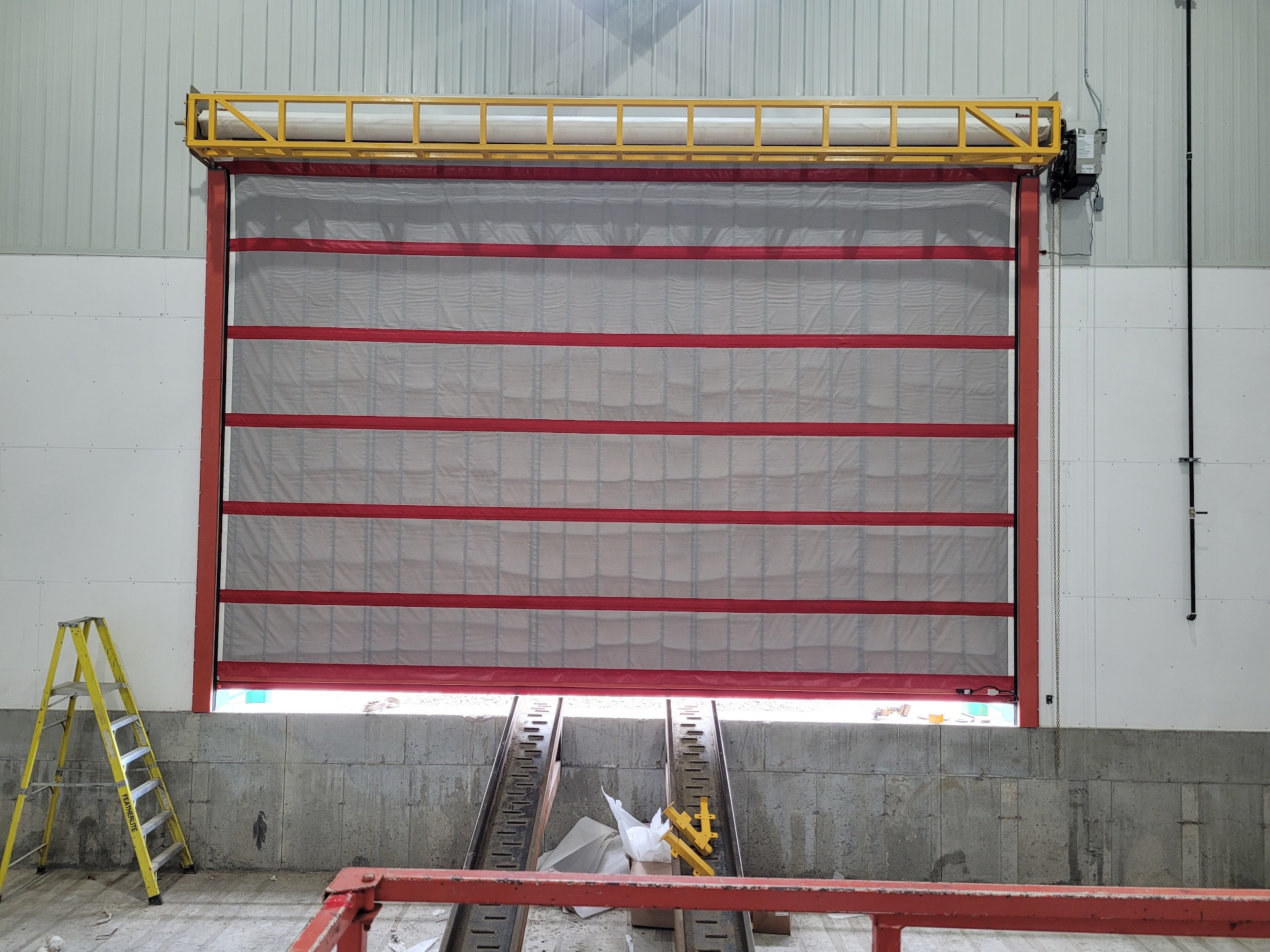 Porte à enroulement rapide